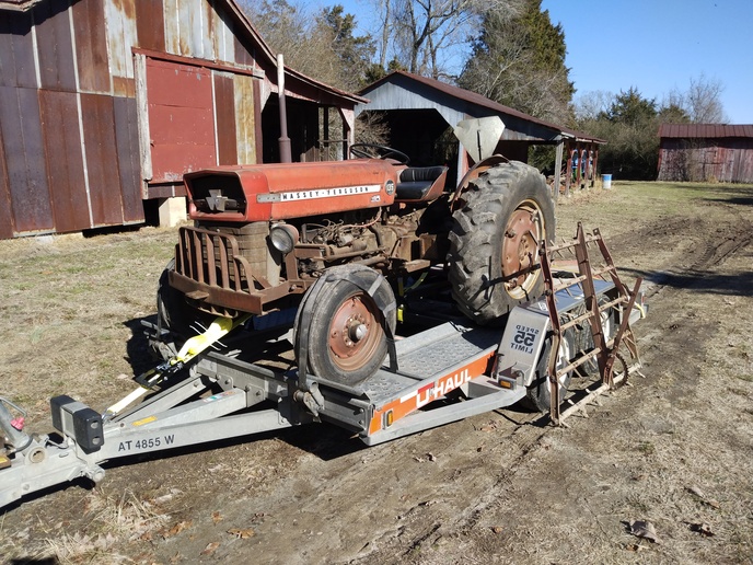 UHaul hauling a tractor Yesterday's Tractors