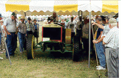 tractor with hard rubber tires and brass grill