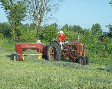 case tractor pulling new holland baler