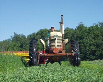 case tractor pulling newholland mower