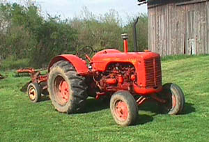 case tractor in front of barn