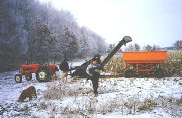 man carrying baby to truck to warm up