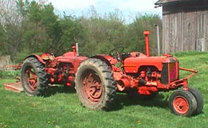 two case tractors on grass