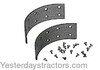 photo of Set of 2 Brake Shoe Linings with Rivets for one wheel. For tractor models IB, B, C, CA, R. Thickness measures .185 inch.