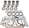 photo of Basic Engine Kit, less bearings for 130, 140, 230, 240. (C123 CID 4-cylinder Gas, standard 3-1\8 inch bore). For tractors with flat head pistons. Cylinder sleeve 3-5\16 inch outside diameter at seal) (sleeve length 6-7\8 inch) (valve length 5-15\64 inch). Kit contains sleeves and sleeve seals, pistons and piston rings, pins and retainers, complete gasket set with crankshaft seals. ENGINE BEARINGS ARE NOT INCLUDED.